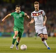 8 October 2015; Wes Hoolahan, Republic of Ireland, in action against Marco Reus, Germany. UEFA EURO 2016 Championship Qualifier, Group D, Republic of Ireland v Germany. Aviva Stadium, Lansdowne Road, Dublin. Picture credit: Ramsey Cardy / SPORTSFILE