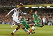 8 October 2015; Thomas Müller, Germany, is tackled by Stephen Ward, Republic of Ireland. UEFA EURO 2016 Championship Qualifier, Group D, Republic of Ireland v Germany. Aviva Stadium, Lansdowne Road, Dublin. Picture credit: Ramsey Cardy / SPORTSFILE