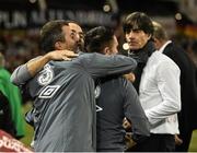 8 October 2015;  Republic of Ireland manager Martin O'Neill celebrates with assistant manager Roy Keane, left, and Robbie Keane as Germany manager Joachim Löw, right, looks on. UEFA EURO 2016 Championship Qualifier, Group D, Republic of Ireland v Germany. Aviva Stadium, Lansdowne Road, Dublin. Picture credit: David Maher / SPORTSFILE
