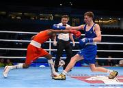 10 October 2015; Brendan Irvine, right, Ireland, exchanges punches with Joahnys Argilagos, Cuba, during their Men's Light Flyweight 46-49kg Quarter-Final bout. AIBA World Boxing Championships, Quarter-Finals, Ali Bin Hamad Al Attiyah Arena, Doha, Qatar. Photo by Sportsfile