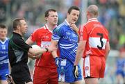 24 May 2009; Raymond Ronaghan, Monaghan, in dispute with Barry McGoldrick and Kevin McCloy, Derry. Ulster GAA Football Senior Championship Quarter-Final, Derry v Monaghan, Celtic Park, Derry. Picture credit: Oliver McVeigh / SPORTSFILE