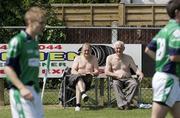 24 May 2009; Two fans watch the London squad warm up before the game. Connacht GAA Football Senior Championship, First Round, London v Galway, Emerald Park, Ruislip, London. Picture credit: Tim Hales / SPORTSFILE