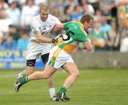 24 May 2009; Neville Coughlan, Offaly, in action against Ronan Sweeney, Kildare. Leinster GAA Football Senior Championship, First Round, Kildare v Offaly, O'Moore Park, Portlaoise, Co. Laois. Photo by Sportsfile