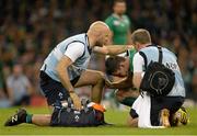 11 October 2015; Jonathan Sexton, Ireland, with Ireland physiotherapist James Allen, right, and Dr Eanna Falvey, Ireland team doctor, before he left the pitch after picking up an injury. 2015 Rugby World Cup Pool D, Ireland v France. Millennium Stadium, Cardiff, Wales. Picture credit: Brendan Moran / SPORTSFILE