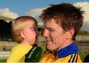 11 October 2015; Sixmilebridge's Niall Gilligan holds his son Michael, 18 months, as he is interviewed by Syl O'Connor, Clare FM, after the game. Clare County Senior Hurling Championship Final, Clonlara v Sixmilebridge. Cusack Park, Ennis, Co. Clare. Picture credit: Piaras Ó Mídheach / SPORTSFILE