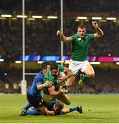 11 October 2015; Rob Kearney, Ireland, goes over to score his side's first try despite the tackle of Brice Dulin and Frederic Michalak, France. 2015 Rugby World Cup Pool D, Ireland v France. Millennium Stadium, Cardiff, Wales. Picture credit: Stephen McCarthy / SPORTSFILE