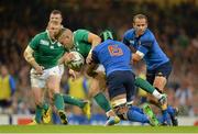 11 October 2015; Ian Madigan, Ireland, is tackled by theirry Dusautoir, center, and Frederic Michalak, France. 2015 Rugby World Cup Pool D, Ireland v France. Millennium Stadium, Cardiff, Wales. Picture credit: Matt Browne / SPORTSFILE