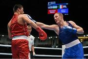 11 October 2015; Michael O'Reilly, right, Ireland, exchanges punches with Bektemir Melikuziev, Uzbekistan, during their Men's Middleweight 75kg Quarter-Final bout. AIBA World Boxing Championships, Semi-Finals, Ali Bin Hamad Al Attiyah Arena, Doha, Qatar. Photo by Sportsfile