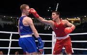 11 October 2015; Bektemir Melikuziev, right, Uzbekistan, exchanges punches with Michael O'Reilly, Ireland, during their Men's Middleweight 75kg Quarter-Final bout. AIBA World Boxing Championships, Semi-Finals, Ali Bin Hamad Al Attiyah Arena, Doha, Qatar. Photo by Sportsfile