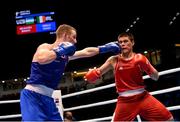 11 October 2015; Michael O'Reilly, left, Ireland, exchanges punches with Bektemir Melikuziev, Uzbekistan, during their Men's Middleweight 75kg Quarter-Final bout. AIBA World Boxing Championships, Semi-Finals, Ali Bin Hamad Al Attiyah Arena, Doha, Qatar. Photo by Sportsfile
