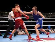 11 October 2015; Michael O'Reilly, right, Ireland, exchanges punches with Bektemir Melikuziev, Uzbekistan, during their Men's Middleweight 75kg Quarter-Final bout. AIBA World Boxing Championships, Semi-Finals, Ali Bin Hamad Al Attiyah Arena, Doha, Qatar. Photo by Sportsfile