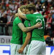 11 October 2015; Jon Walters, Republic of Ireland, celebrates with team-mates James McClean and Jeff Hendrick after scoring his side's opening goal. UEFA EURO 2016 Championship Qualifier, Group D, Poland v Republic of Ireland. Stadion Narodowy, Warsaw, Poland. Picture credit: Seb Daly / SPORTSFILE