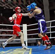 30 May 2009; Joe Ward, Ireland, red, on his way to winning gold with victory against Hayk Khachatryan, Armenia. Joe Ward was 16-1 up when the bout was stopped. AIBA World Junior Championships Yerevan 2009, Light Middle 70KG Final. Yerevan, Armenia. Picture credit: SPORTSFILE / Courtesy of AIBA