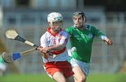 30 May 2009; Colm Murphy, Derry, in action against Keith Kennedy, London. Ulster GAA Hurling Senior Championship Quarter-Final, Derry v London, Casement Park, Belfast. Picture credit: Oliver McVeigh / SPORTSFILE