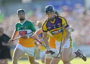 30 May 2009; David O'Connor, Wexford, in action against Shane Dooley, Offaly. Leinster GAA Hurling Senior Championship First Round, Wexford v Offaly, Wexford Park, Wexford. Picture credit: Matt Browne / SPORTSFILE