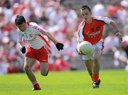 31 May 2009; Robbie Tasker, Armagh, in action against Shea McGarrity, Tyrone. Ulster GAA Football Minor Championship, Tyrone v Armagh, St. Tiernach's Park, Clones, Co.Monaghan. Photo by Sportsfile