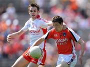 31 May 2009; James Morgan, Armagh, in action against Ronan McNamee, Tyrone. Ulster GAA Football Minor Championship, Tyrone v Armagh, St. Tiernach's Park, Clones, Co.Monaghan. Photo by Sportsfile
