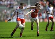 31 May 2009; Mark Faloon, Tyrone, in action against Andrew Mumin, Armagh. Ulster GAA Football Minor Championship, Tyrone v Armagh, St. Tiernach's Park, Clones, Co.Monaghan. Picture credit: Oliver McVeigh / SPORTSFILE