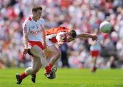 31 May 2009; Mark Faloon, Tyrone, in action against James Donnelly, Armagh. Ulster GAA Football Minor Championship, Tyrone v Armagh, St. Tiernach's Park, Clones, Co.Monaghan. Photo by Sportsfile