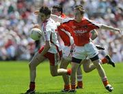 31 May 2009; Colin Hicks, Tyrone, in action against Peter Carragher and Ryan Rafferty, Armagh. Ulster GAA Football Minor Championship, Tyrone v Armagh, St. Tiernach's Park, Clones, Co.Monaghan. Picture credit: Oliver McVeigh / SPORTSFILE