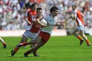 31 May 2009; Tiernan McCann, Tyrone, in action against Robbie Tasker, Armagh. Ulster GAA Football Minor Championship, Tyrone v Armagh, St. Tiernach's Park, Clones, Co.Monaghan. Picture credit: Oliver McVeigh / SPORTSFILE