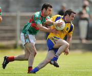 31 May 2009; Eamon Towey, Roscommon, in action against Marcus Hannick, Mayo. Connacht GAA Football Junior Championship Final, Mayo v Roscommon, Pairc Sean Mac Diarmada, Carrick-On-Shannon, Co Leitrim. Picture credit: David Maher / SPORTSFILE