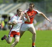 31 May 2009; Kevin Hughes, Tyrone, in action against James Lavery, Armagh. Ulster GAA Football Senior Championship Quarter-Final, Tyrone v Armagh, St. Tiernach's Park, Clones, Co.Monaghan. Picture credit: Oliver McVeigh / SPORTSFILE