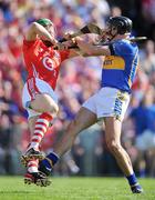 31 May 2009; Michael Webster, Tipperary, and Eoin Cadogan, Cork, clash during the game. Munster GAA Hurling Senior Championship Quarter-Final, Tipperary v Cork, Semple Stadium, Thurles, Co. Tipperary. Picture credit: Brendan Moran / SPORTSFILE