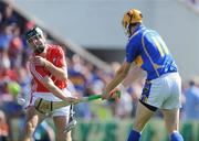 31 May 2009; Seamus Callanan, Tipperary, scores his side's goal as Ronan Curran, Cork, comes in to challenge. Munster GAA Hurling Senior Championship Quarter-Final, Tipperary v Cork, Semple Stadium, Thurles, Co. Tipperary. Picture credit: Brendan Moran / SPORTSFILE