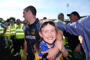 31 May 2009; Aisling Sheedy, daughter of Tipperary manager Liam Sheedy, smiles as she leaves the pitch with her dad after the game. Munster GAA Hurling Senior Championship Quarter-Final, Tipperary v Cork, Semple Stadium, Thurles, Co. Tipperary. Picture credit: Brendan Moran / SPORTSFILE