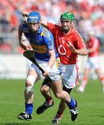 31 May 2009; John O'Brien, Tipperary, in action against Jerry O'Connor, Cork. Munster GAA Hurling Senior Championship Quarter-Final, Tipperary v Cork, Semple Stadium, Thurles, Co. Tipperary. Picture credit: Daire Brennan / SPORTSFILE