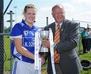 30 May 2009; Angela Walsh, Munster, is presented with the Interprovincial Final cup by Pat Quill, Ladies GAA President. 2009 Inter Provincials - Inter Provincial Final, Munster v Leinster, Kinnegad GAA Club, Co. Westmeath. Picture credit: Diarmuid Greene / SPORTSFILE