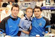 30 May 2009; Dublin fans turned out at Arnotts to cheer on their team as they prepare for the 2009 Championship season. Bernard Brogan, right, and Denis Bastick with Dubs fan Michael Noonan, age 9, from Whitehall, while signing autographs in the sports department of Arnotts. Arnott's, Henry St, Dublin. Picture credit: Brendan Moran / SPORTSFILE