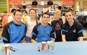 30 May 2009; Dublin fans turned out at Arnotts to cheer on their team as they prepare for the 2009 Championship season. Captain Paul Griffin, right, along with Bernard Brogan and Denis Bastick, left, with Eirinn, age 8, and James Heery, age 7, children of former Dublin footballer Eamonn Heery, while signing autographs in the sports department of Arnotts. Arnott's, Henry St, Dublin. Picture credit: Brendan Moran / SPORTSFILE