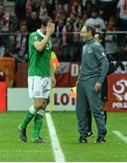 11 October 2015; John O'Shea, Republic of Ireland, walks off the pitch after being sent off after a tackle on Robert Lewandowski, Poland. UEFA EURO 2016 Championship Qualifier, Group D, Poland v Republic of Ireland. Stadion Narodowy, Warsaw, Polan Picture credit: David Maher / SPORTSFILE