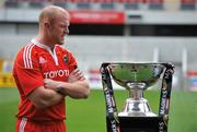 25 August 2009; Munster's Paul O'Connell alongside the Magners League trophy during the 2009/2010 Magners League Season Launch. Thomond Park, Limerick. Picture credit: Diarmuid Greene / SPORTSFILE