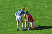 31 May 2009; Lar Corbett, Tipperary, comforts Cork sub Cathal Naughton after the game. Munster GAA Hurling Senior Championship Quarter-Final, Tipperary v Cork, Semple Stadium, Thurles, Co. Tipperary. Picture credit: Ray McManus / SPORTSFILE