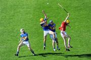 31 May 2009; Tipperary players Brendan maher, no.24, James Woodflock and Benny Dunne, in action against Cathal Naughton, Cork. Munster GAA Hurling Senior Championship Quarter-Final, Tipperary v Cork, Semple Stadium, Thurles, Co. Tipperary. Picture credit: Ray McManus / SPORTSFILE