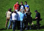 31 May 2009; Team captains John Gardiner, Cork, and Conor O'Mahony, Tipperary, stand with referee Barry Kelly before the game. Munster GAA Hurling Senior Championship Quarter-Final, Tipperary v Cork, Semple Stadium, Thurles, Co. Tipperary. Picture credit: Ray McManus / SPORTSFILE