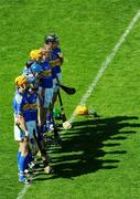 31 May 2009; Tipperary players stand for the national anthem before the game. Munster GAA Hurling Senior Championship Quarter-Final, Tipperary v Cork, Semple Stadium, Thurles, Co. Tipperary. Picture credit: Ray McManus / SPORTSFILE