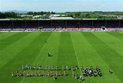 31 May 2009; The Cork and Tipperary teams march in the pre-match padade. Munster GAA Hurling Senior Championship Quarter-Final, Tipperary v Cork, Semple Stadium, Thurles, Co. Tipperary. Picture credit: Ray McManus / SPORTSFILE