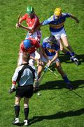 31 May 2009; Referee Barry Kelly throws the sliothar in between Cork's Tom Kenny and Jerry O'Connor and Tipperary's James Woodlock and Shane McGrath to get the game under way. Munster GAA Hurling Senior Championship Quarter-Final, Tipperary v Cork, Semple Stadium, Thurles, Co. Tipperary. Picture credit: Ray McManus / SPORTSFILE