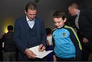 15 October 2015; Former Tipperary goalkeeper Brendan Cummins signs a copy of his book for Barry Ryan, aged 12, from Borrisokane, Co. Tipperary, at the official launch of 'Standing My Ground', The Brendan Cummins autobiography. Semple Stadium, Thurles, Co. Tipperary. Picture credit: Diarmuid Greene / SPORTSFILE