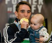 16 October 2015; Ireland gold medal winner Michael Conlan, Bantam weight, with his daughter Luisne, age 7 months, at Team Ireland's return from the AIBA World Boxing Championships, in Doha, Qatar. Team Ireland return from the AIBA World Boxing Championships. Dublin Airport, Dublin. Picture credit: Sam Barnes / SPORTSFILE