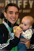 16 October 2015; Ireland gold medal winner Michael Conlan, Bantam weight, with his daughter Luisne, age 7 months, at Team Ireland's return from the AIBA World Boxing Championships, in Doha, Qatar. Team Ireland return from the AIBA World Boxing Championships. Dublin Airport, Dublin. Picture credit: Sam Barnes / SPORTSFILE