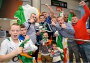 16 October 2015; Joe Ward, Heavyweight Silver Medalist, is mobbed by friends and family at Team Ireland's return from the AIBA World Boxing Championships, in Doha, Qatar. Team Ireland return from the AIBA World Boxing Championships. Dublin Airport, Dublin. Picture credit: Sam Barnes / SPORTSFILE