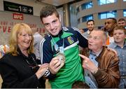 16 October 2015; Joe Ward, Heavyweight Silver Medalist, pictured with Mary Ryan, left, and his former boxing coach Sheamus Dorrington, from Moate, Co. Westmeath, at Team Ireland's return from the AIBA World Boxing Championships, in Doha, Qatar. Team Ireland return from the AIBA World Boxing Championships. Dublin Airport, Dublin. Picture credit: Sam Barnes / SPORTSFILE