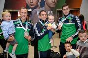16 October 2015; Ireland's Boxing Medalists, from left, Michael O'Reilly, with his son MJ, Michael Conlan, with his daughter Luisne, and Joe Ward, at Team Ireland's return from the AIBA World Boxing Championships, in Doha, Qatar. Team Ireland return from the AIBA World Boxing Championships. Dublin Airport, Dublin. Picture credit: Sam Barnes / SPORTSFILE