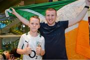 16 October 2015; Olympic Boxer Paddy Barnes, poses for a photograph with young fan Charlie Maughan, at Team Ireland's return from the AIBA World Boxing Championships, in Doha, Qatar. Team Ireland return from the AIBA World Boxing Championships. Dublin Airport, Dublin. Picture credit: Sam Barnes / SPORTSFILE
