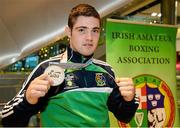 16 October 2015; Joe Ward, Heavyweight Silver Medallist, poses for a photograph with his medal, at Team Ireland's return from the AIBA World Boxing Championships, in Doha, Qatar. Team Ireland return from the AIBA World Boxing Championships. Dublin Airport, Dublin. Picture credit: Sam Barnes / SPORTSFILE